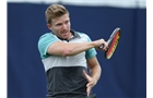 EASTBOURNE, ENGLAND - JUNE 14: Daniel Cox of Great Britain plays a forehand against Rhett Purcell of Great Britain during their Men's Singles qualifying match on day one of the Aegon International at Devonshire Park on June 14, 2014 in Eastbourne, England.  (Photo by Steve Bardens/Getty Images)